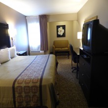 King Bedroom at Ramada by Wyndham Fresno